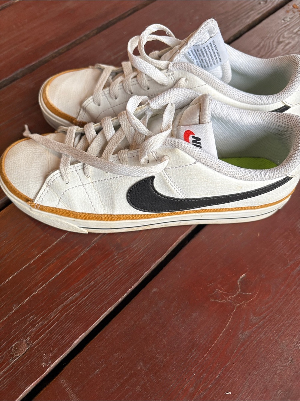 Nike White Low-Top Sneakers with Black Swoosh and Tan Trim